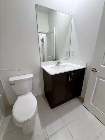 Well-appointed guest bathroom featuring modern cabinetry, neutral finishes, and a clean, updated look.