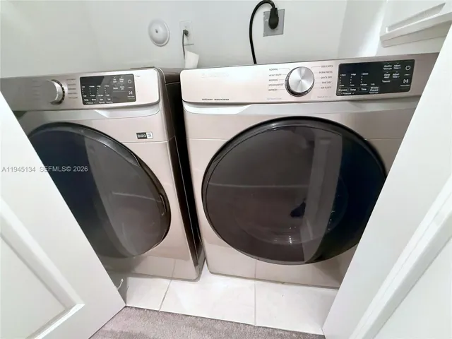 Dedicated laundry area with washer and dryer conveniently located upstairs for everyday use.
