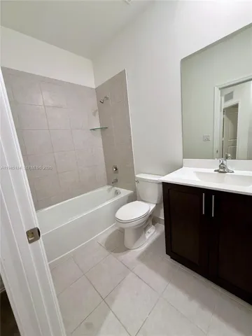 Another view of the guest bathroom highlighting its functional layout and contemporary design.