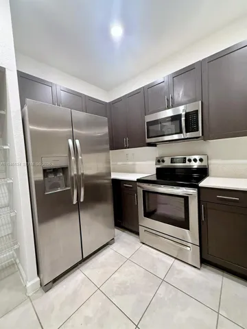 Additional view of the modern kitchen showcasing contemporary cabinetry, sleek finishes, and a clean, functional layout ideal for everyday cooking.