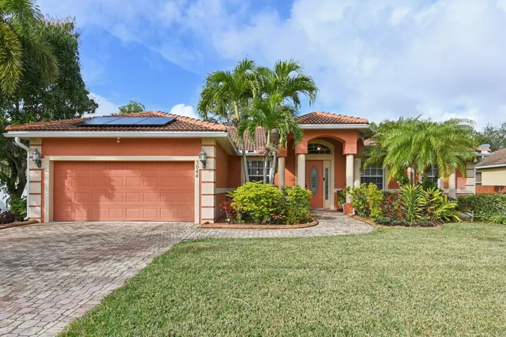 Port St. Lucie pool home offering 4 bedrooms, 3 baths, and nearly 2,500 sq ft.