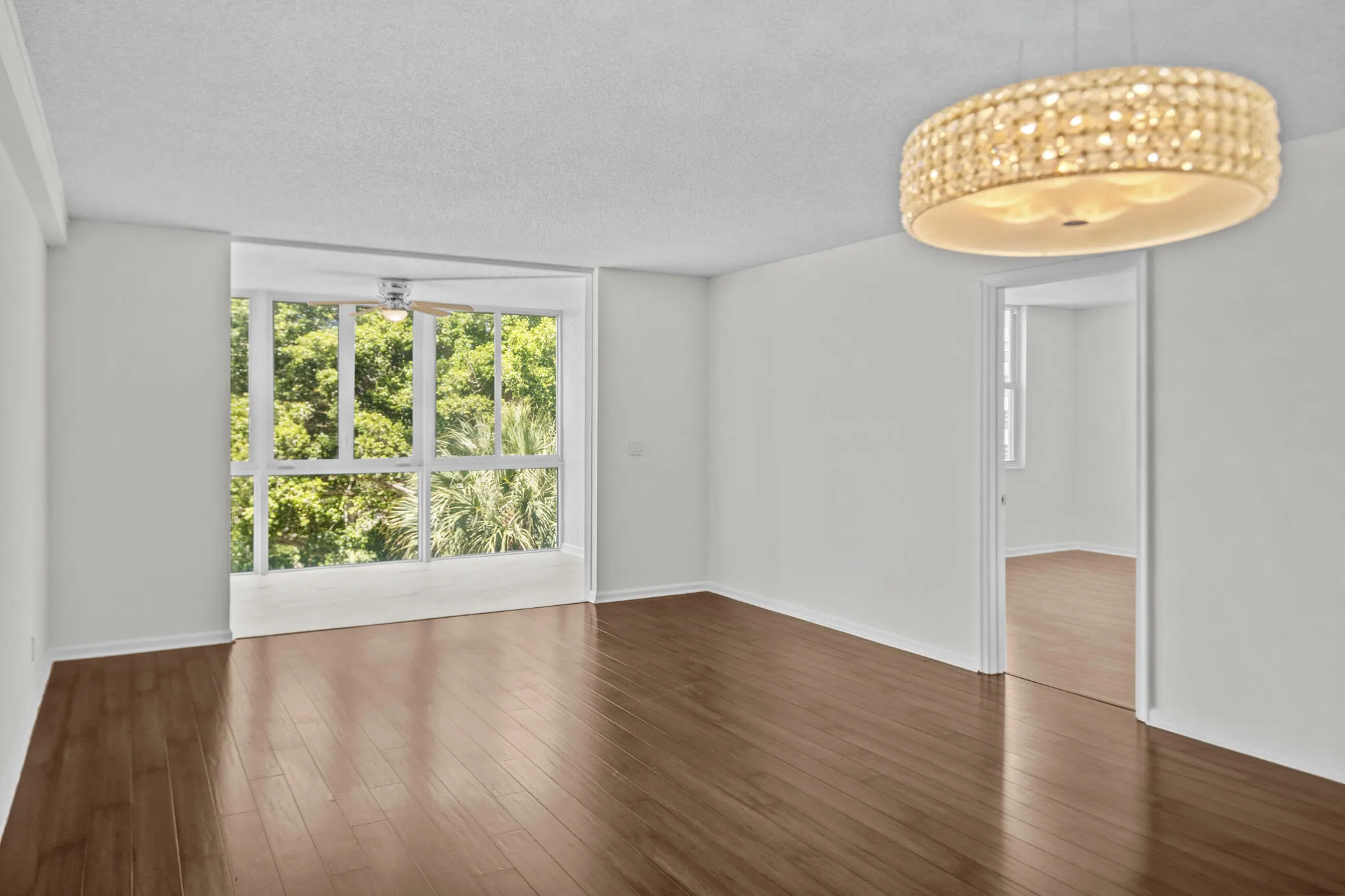 Living and florida room looking through the kitchen pass through window.