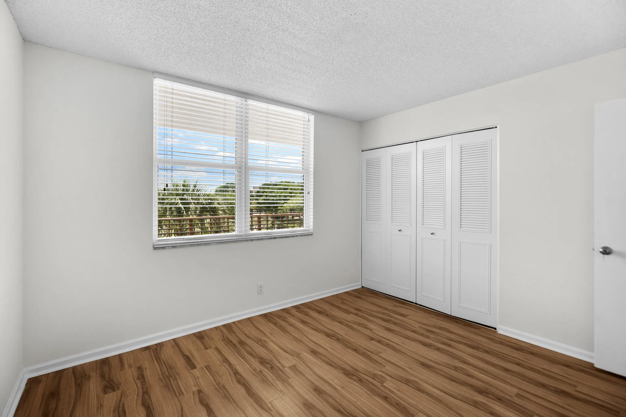 2nd Bedroom freshly painted with new storm windows.