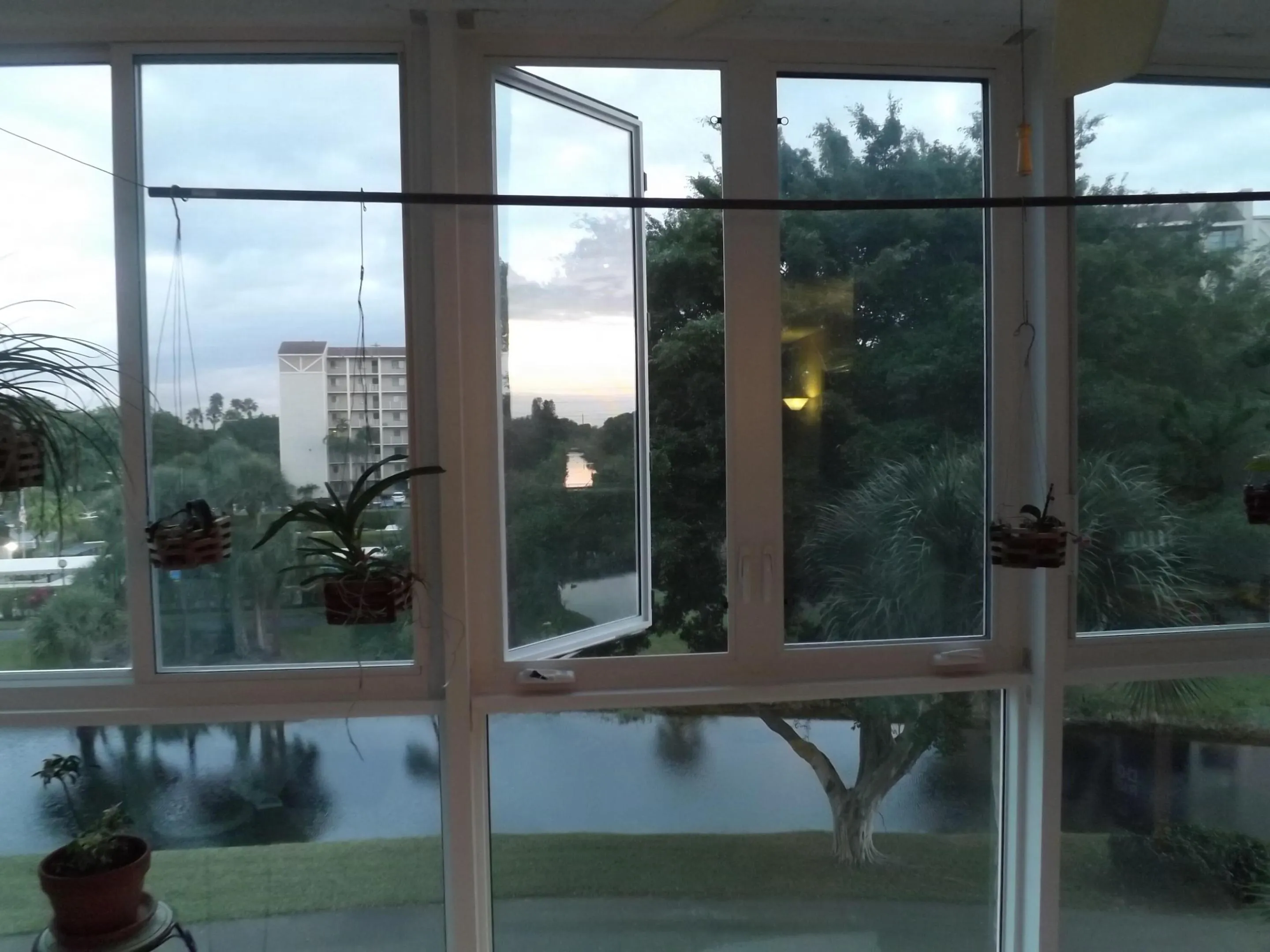Extended living room Porch with new custom storm windows. The windows can open for a nice breeze!