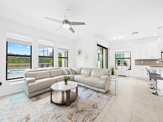 Living room with a view of lake and pool