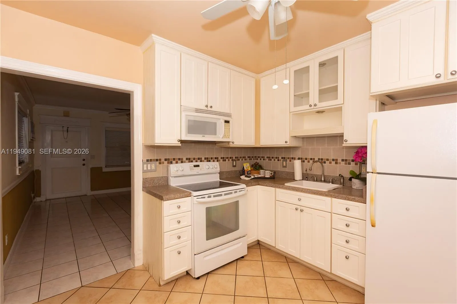 Plenty Kitchen Cabinets. Tankless Water Heater Under Sink.