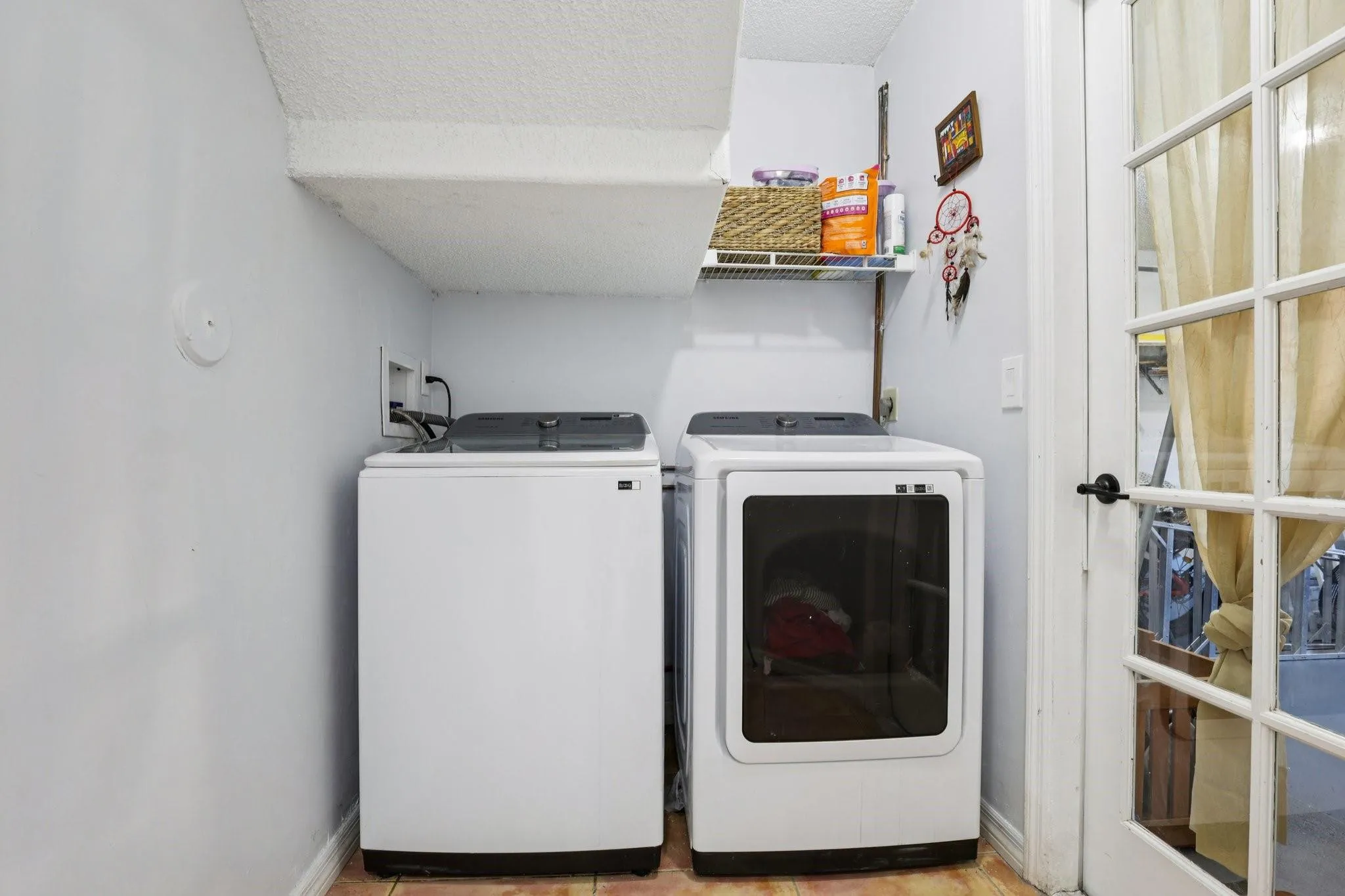 The laundry room is conveniently located on the main level, offering practical functionality without disrupting the home’s living spaces. Its dedicated layout provides room for appliances and storage, helping keep household tasks organized and efficient.