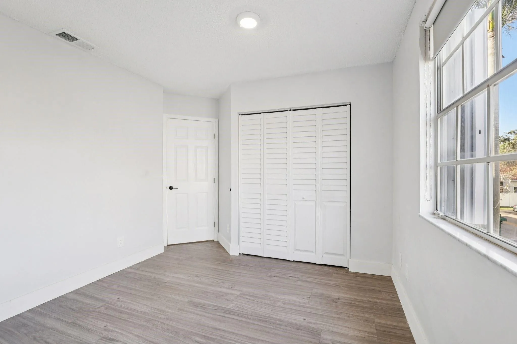 Natural separation from the primary suite adds to the home’s balanced layout.