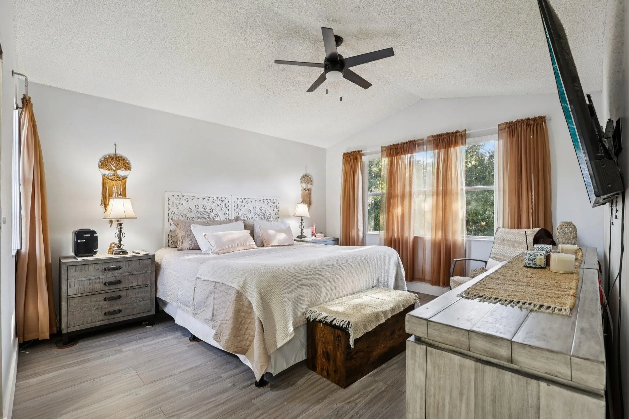 The primary bedroom is a spacious and private retreat designed for relaxation.