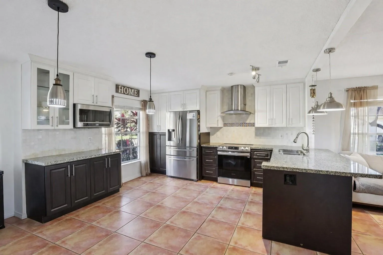 The dining area is ideally positioned to connect the kitchen and family room, creating a natural gathering space for meals