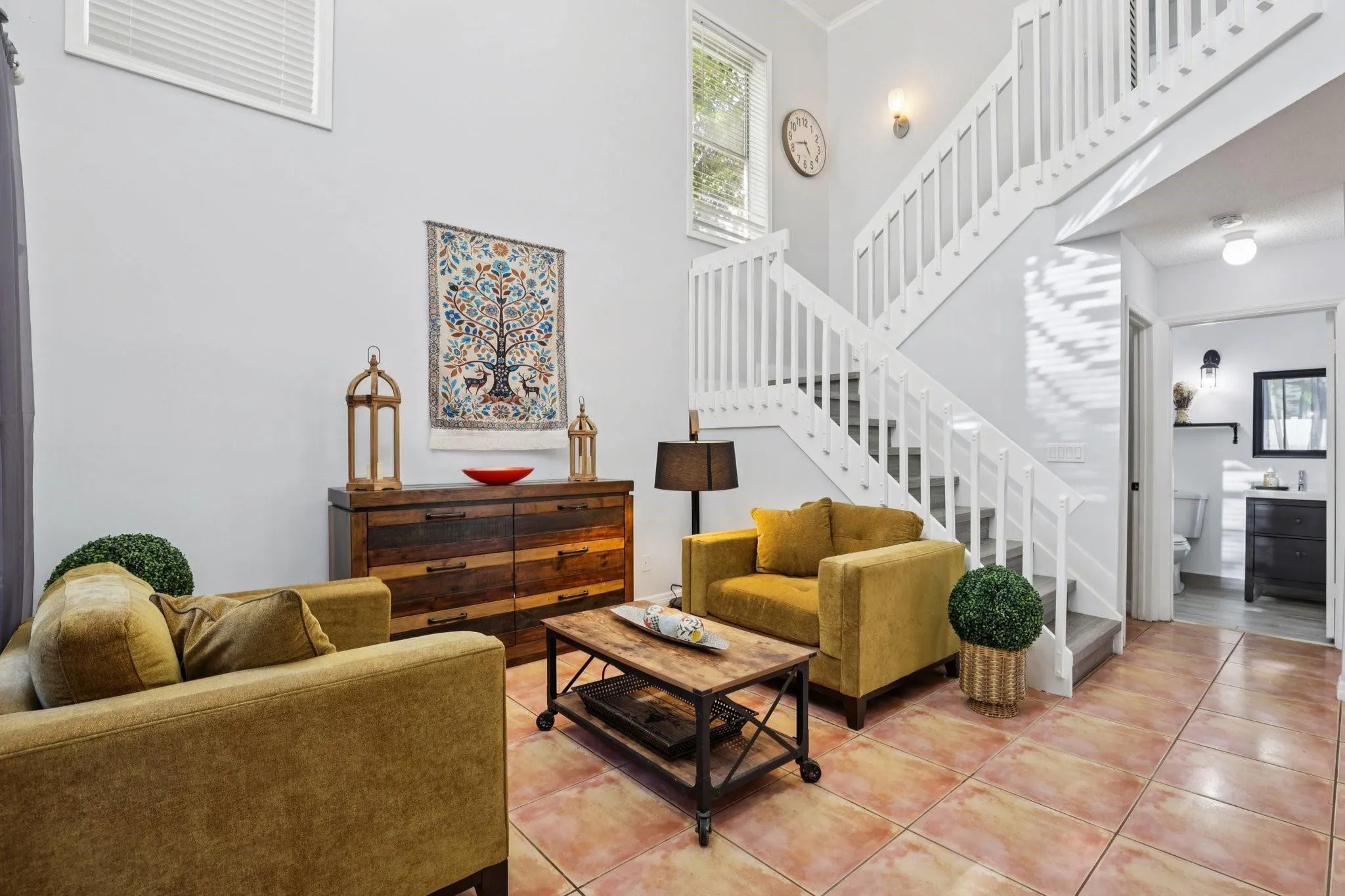 While open and airy, it still maintains a sense of separation from the more casual family spaces, allowing for a more refined entertaining area.