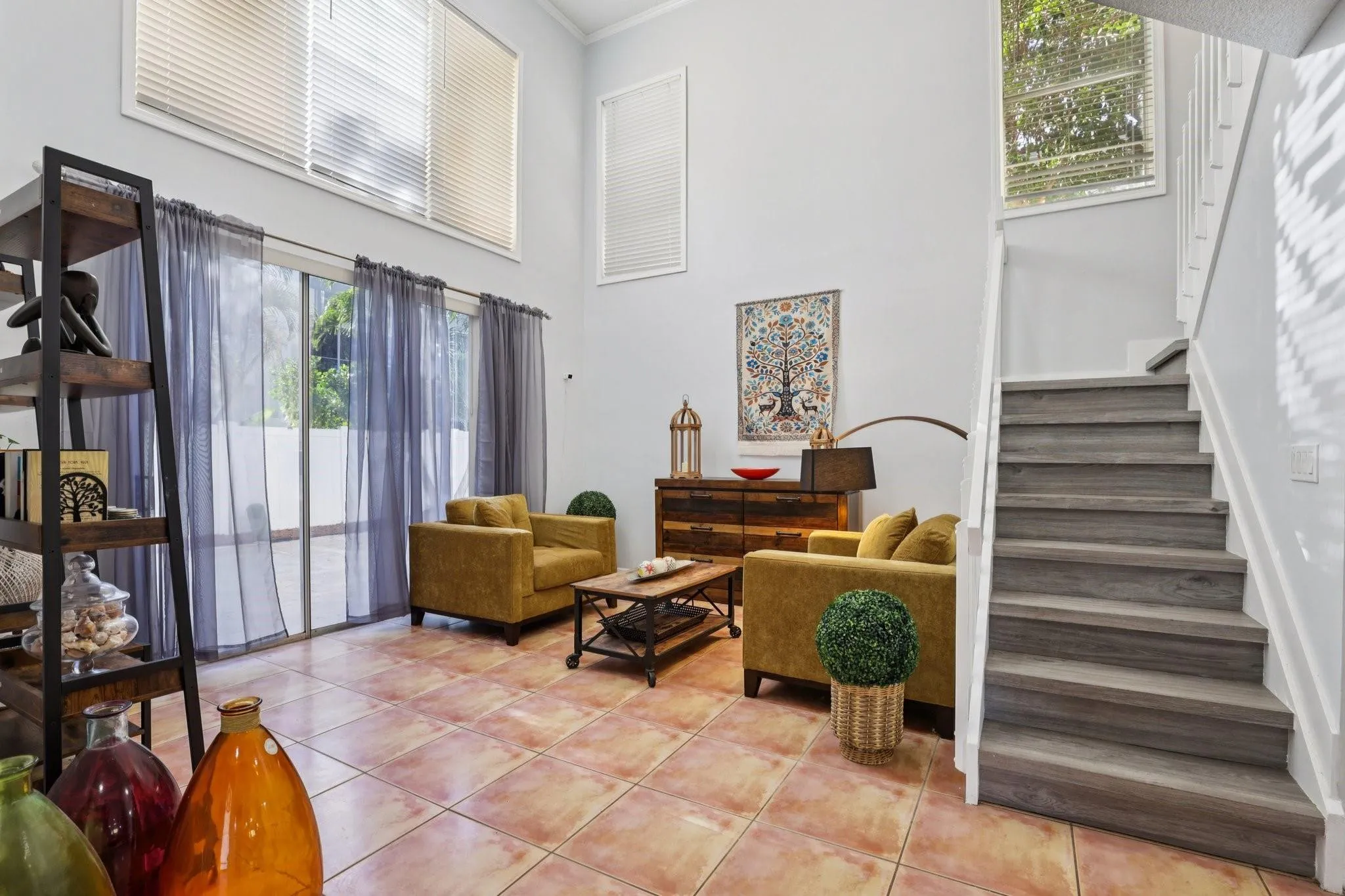 The living room is spacious and inviting, offering a versatile setting for both formal gatherings and relaxed everyday living.