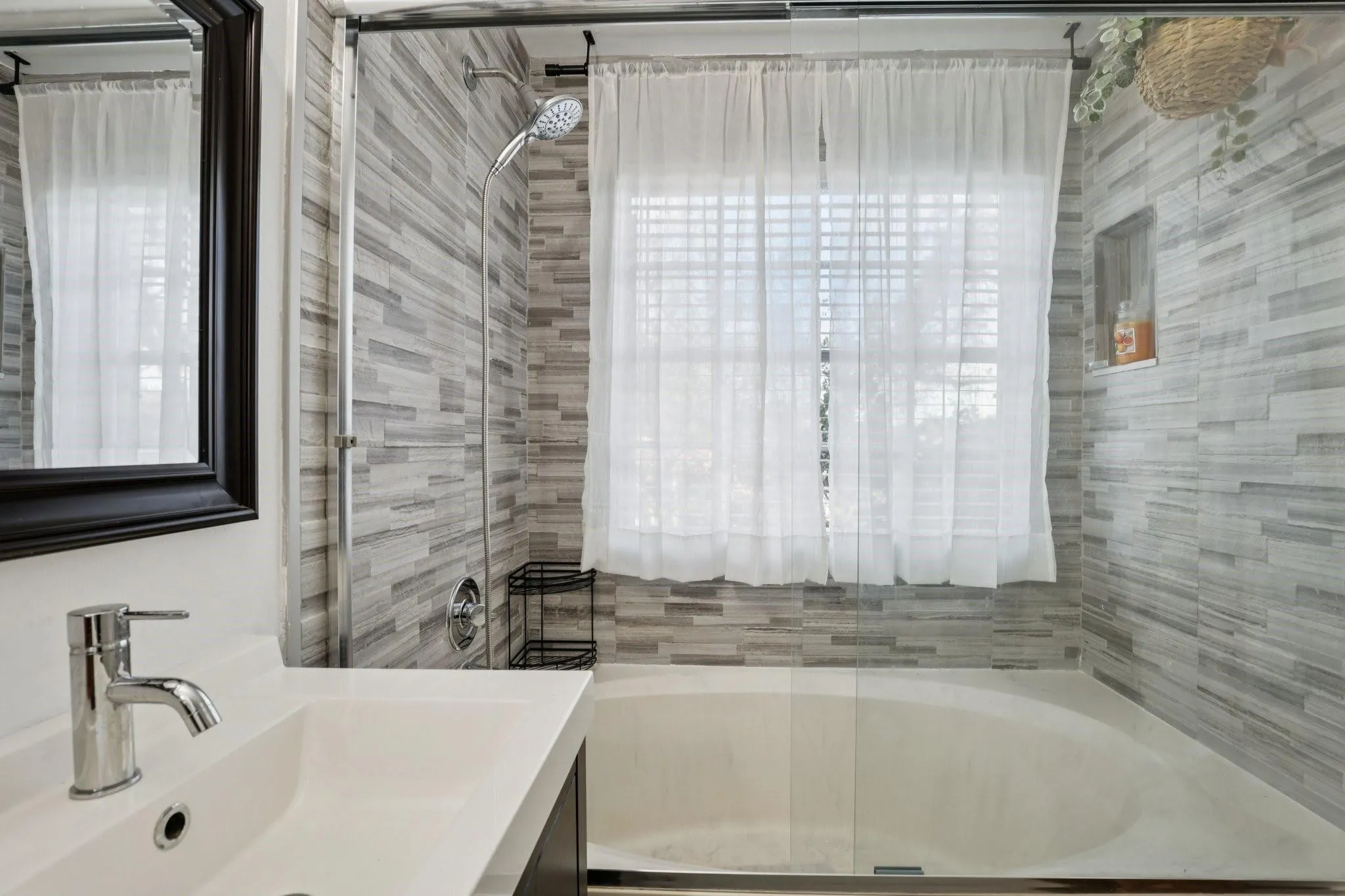 The primary bathroom features a functional and well-organized layout that balances comfort and practicality.