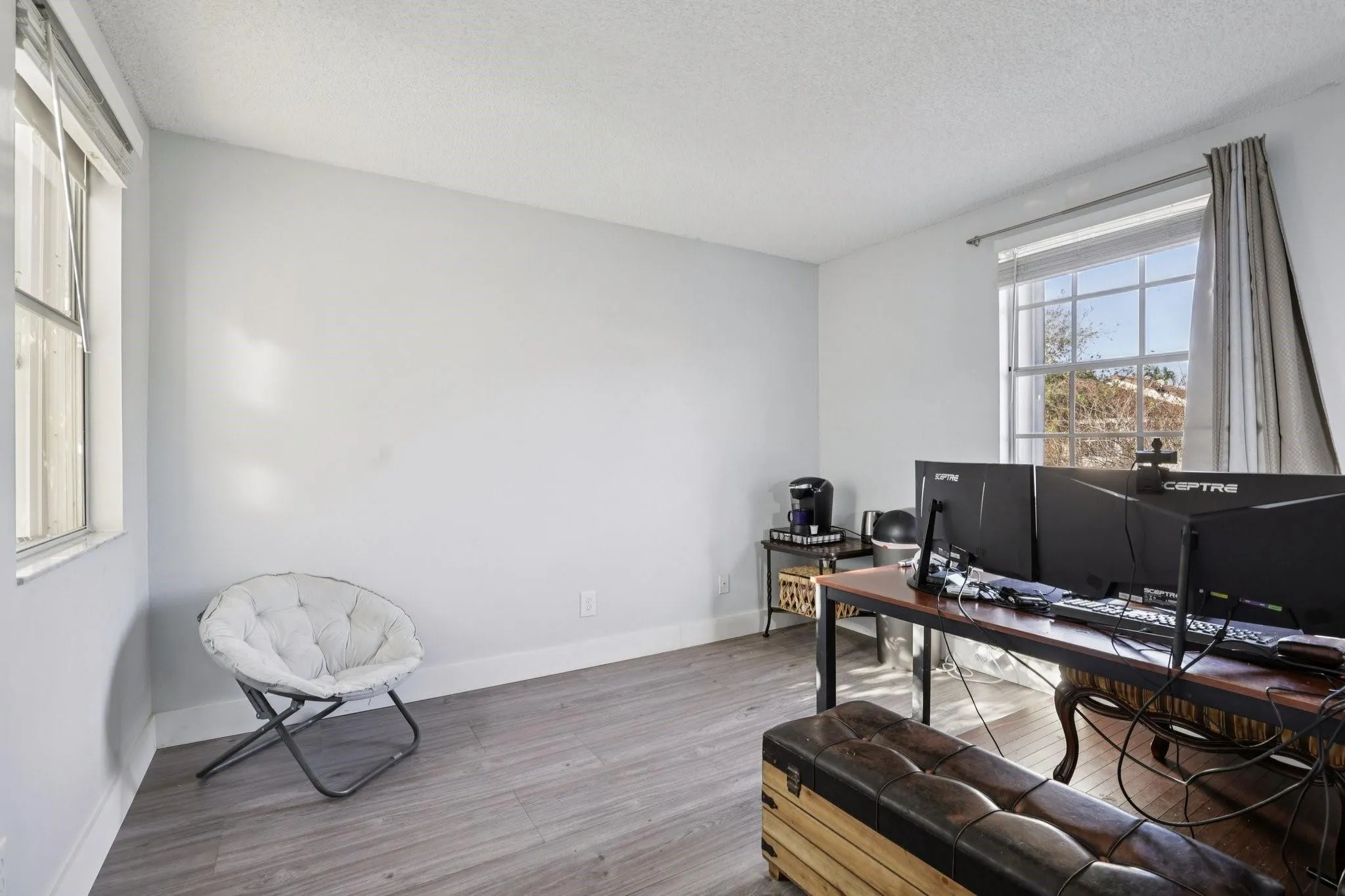 his additional bedroom offers a versatile space ideal for a dedicated home office, gaming room, or creative studio.