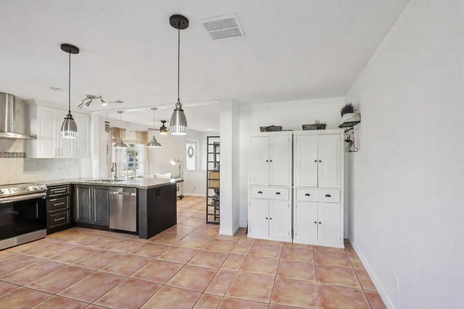 Its open placement allows for easy hosting while maintaining a defined area for dining.
