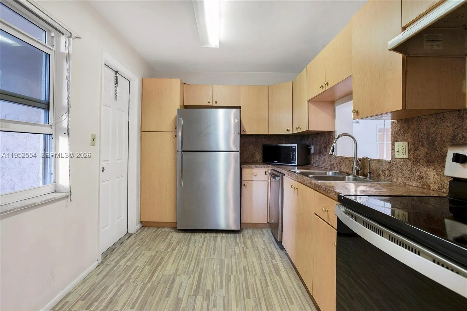 KITCHEN WITH BACK DOOR AND WINDOW