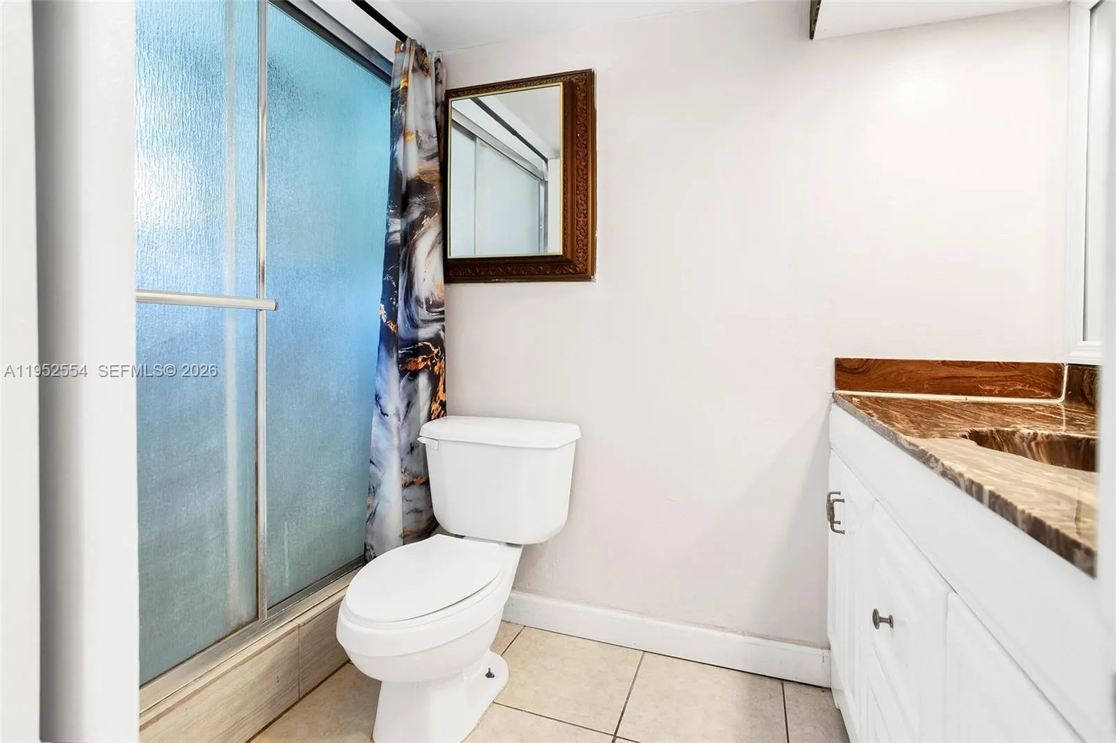 PRIMARY BATHROOM WITH UPDATED SHOWER