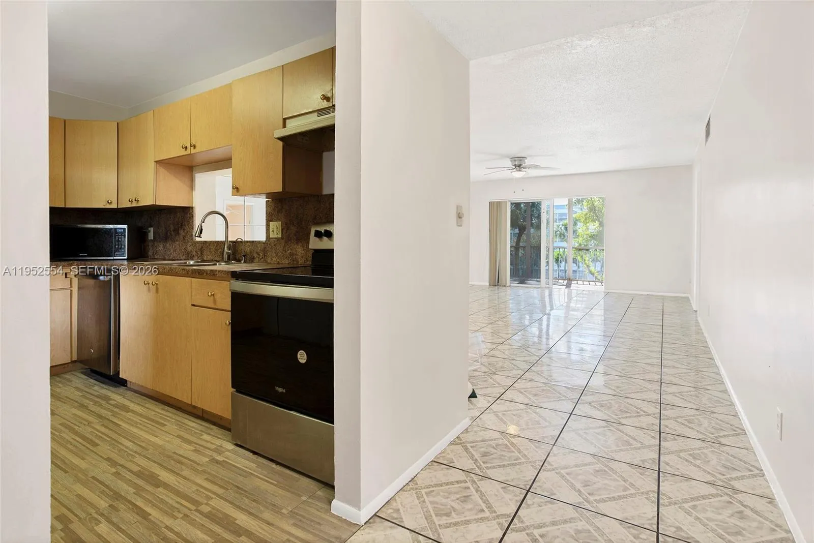 LARGE KITCHEN LEADING TO DINING ROOM