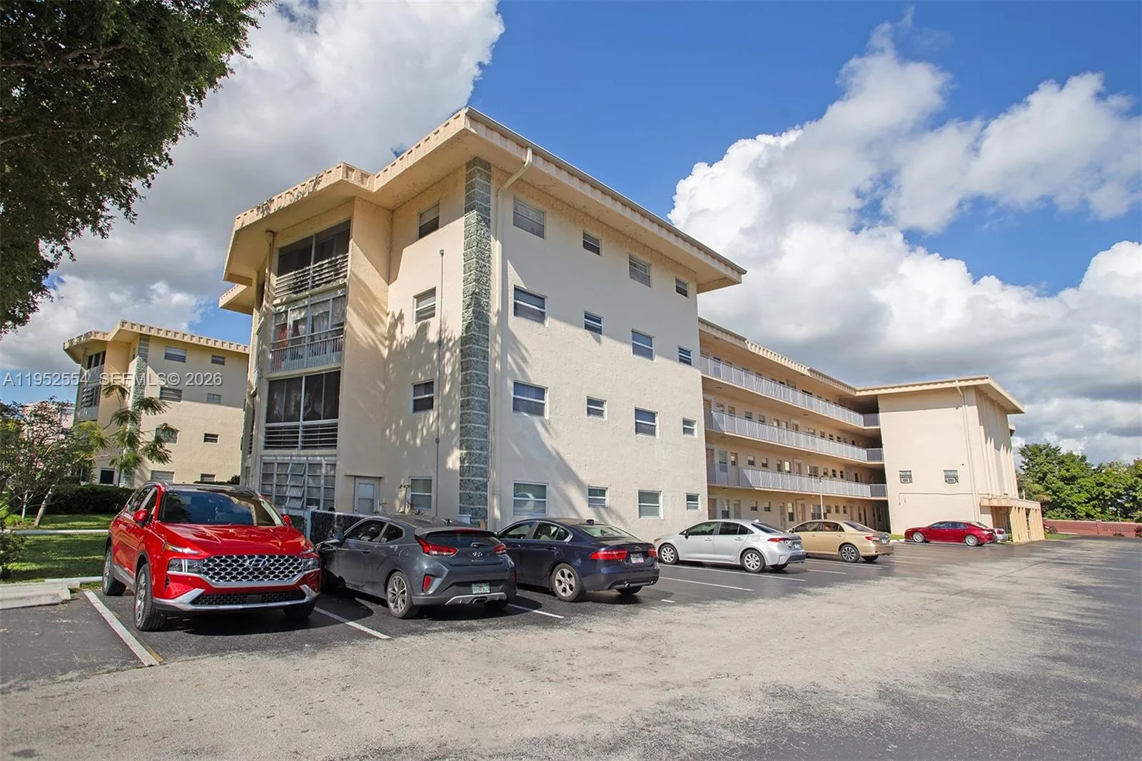 FRONT PARKING LOT WITH VISITOR SPACES