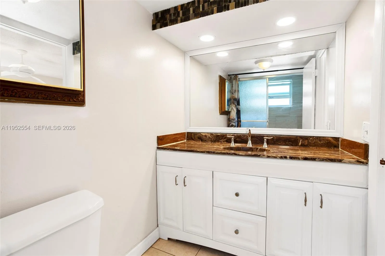 PRIMARY BATHROOM WITH UPDATED COUNTERTOP/CABINETS
