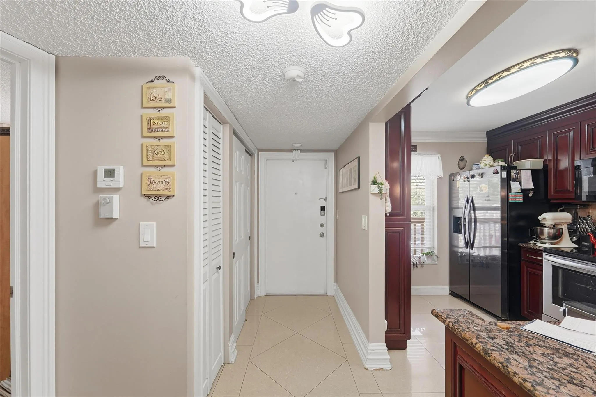 From the living area to the front door...on the left, you have a pantry