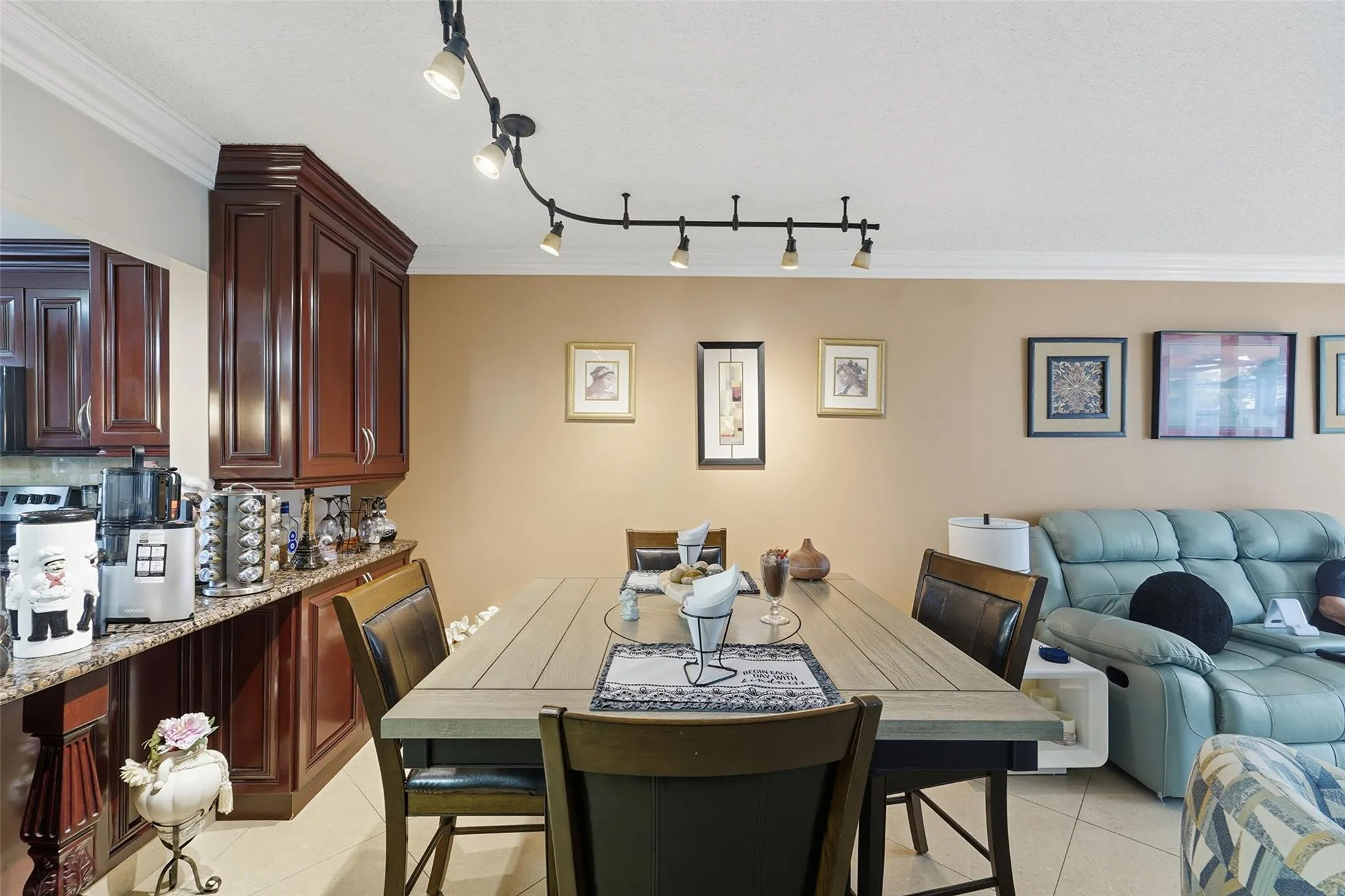 Here is your dining area. I love the track lighting and extra storage.