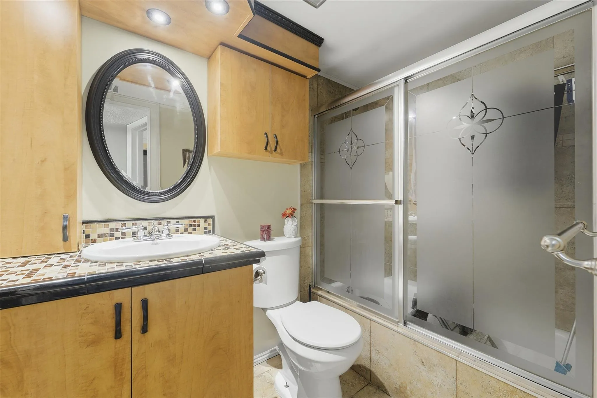 The guest bath has a tub and updated fixtures.