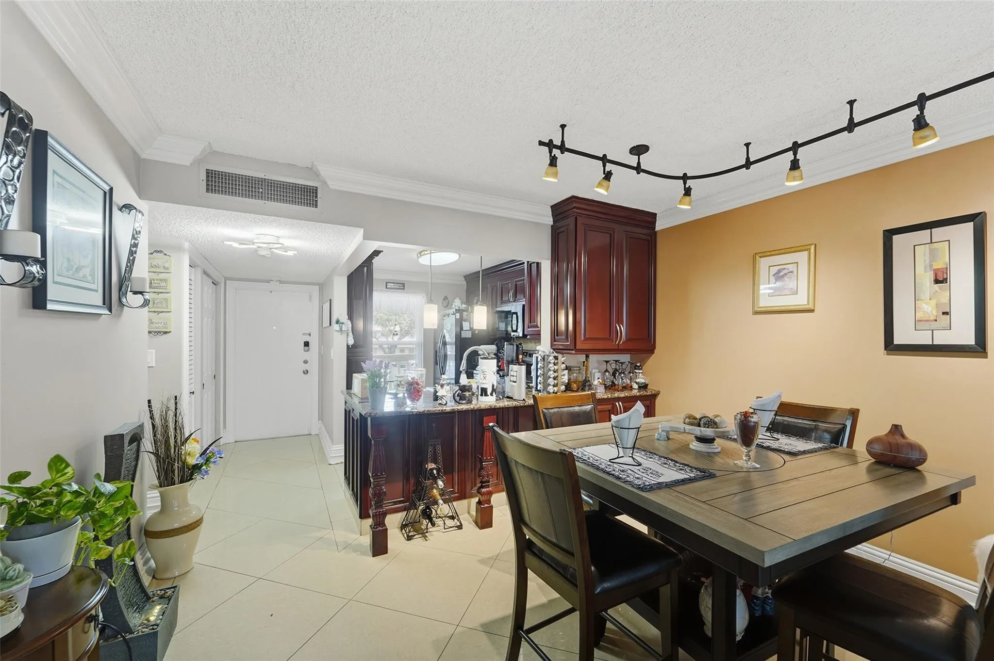 Your kitchen is open to the rest of the property. Notice the porcelain tile laid diagonally.