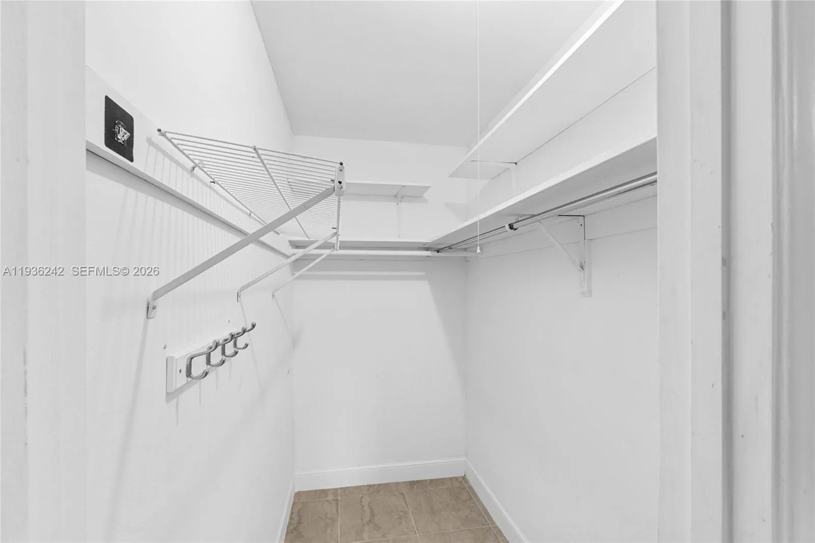 Walk-in closet in bedroom 2 (with the screen-in patio access)