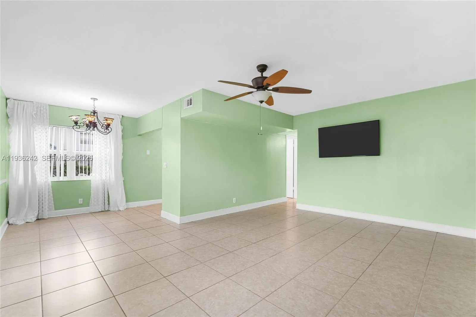 Virtually staged living room (Already mounted TV included in purchase)