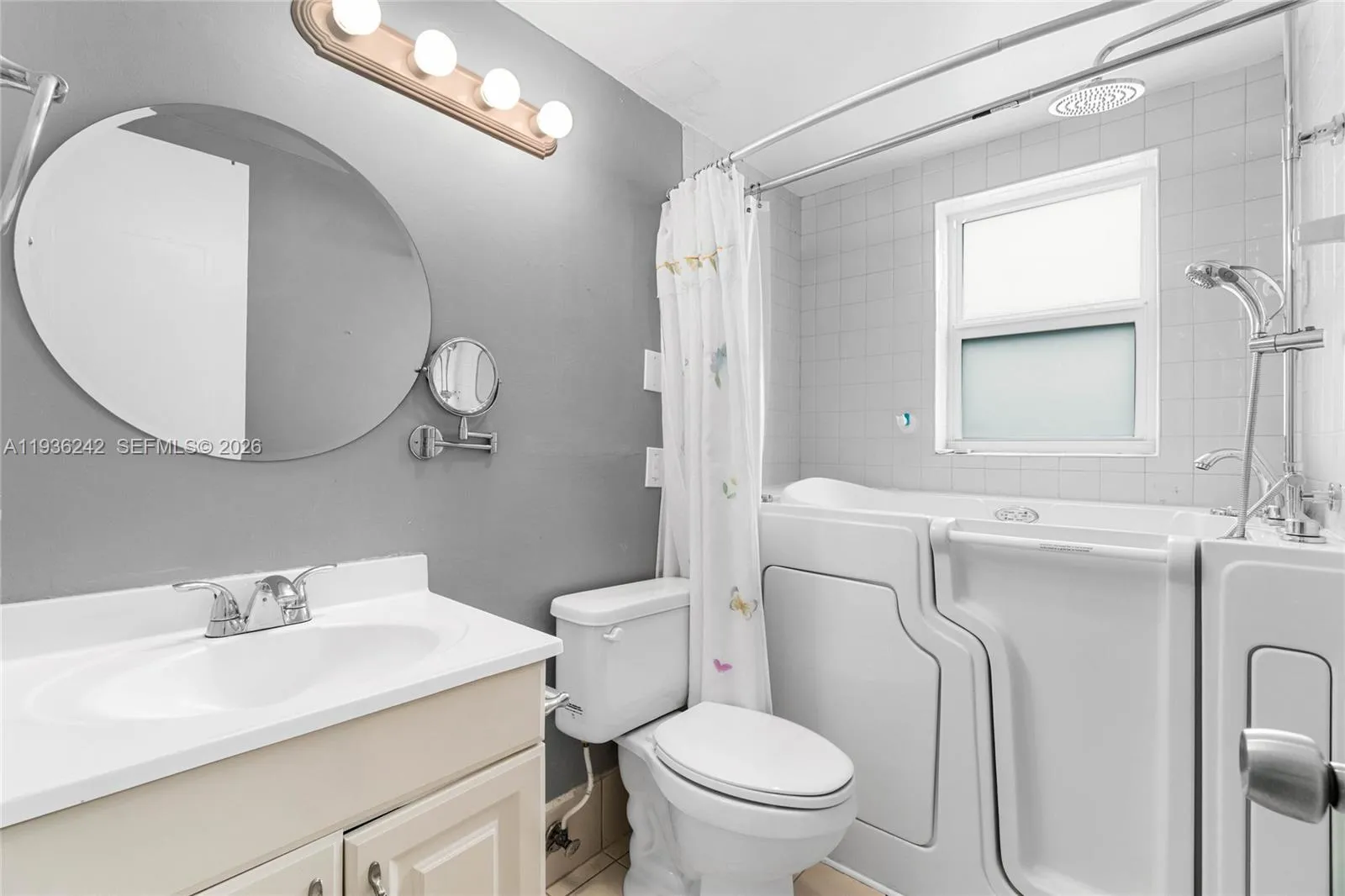 Full bathroom with upgraded Safe Step spa tub installed in 2022. 30 yr warranty included on tub.