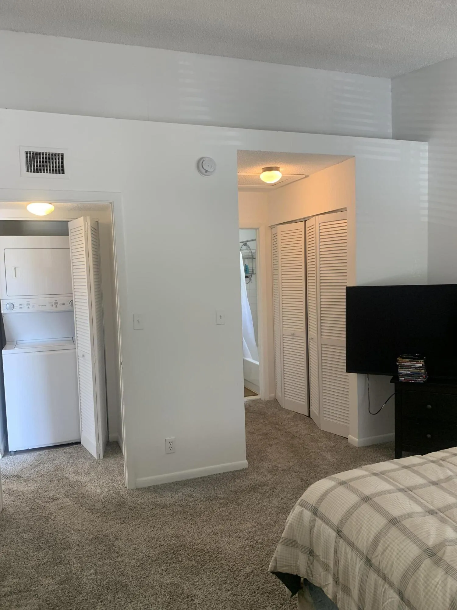 Primary bedroom from different POV