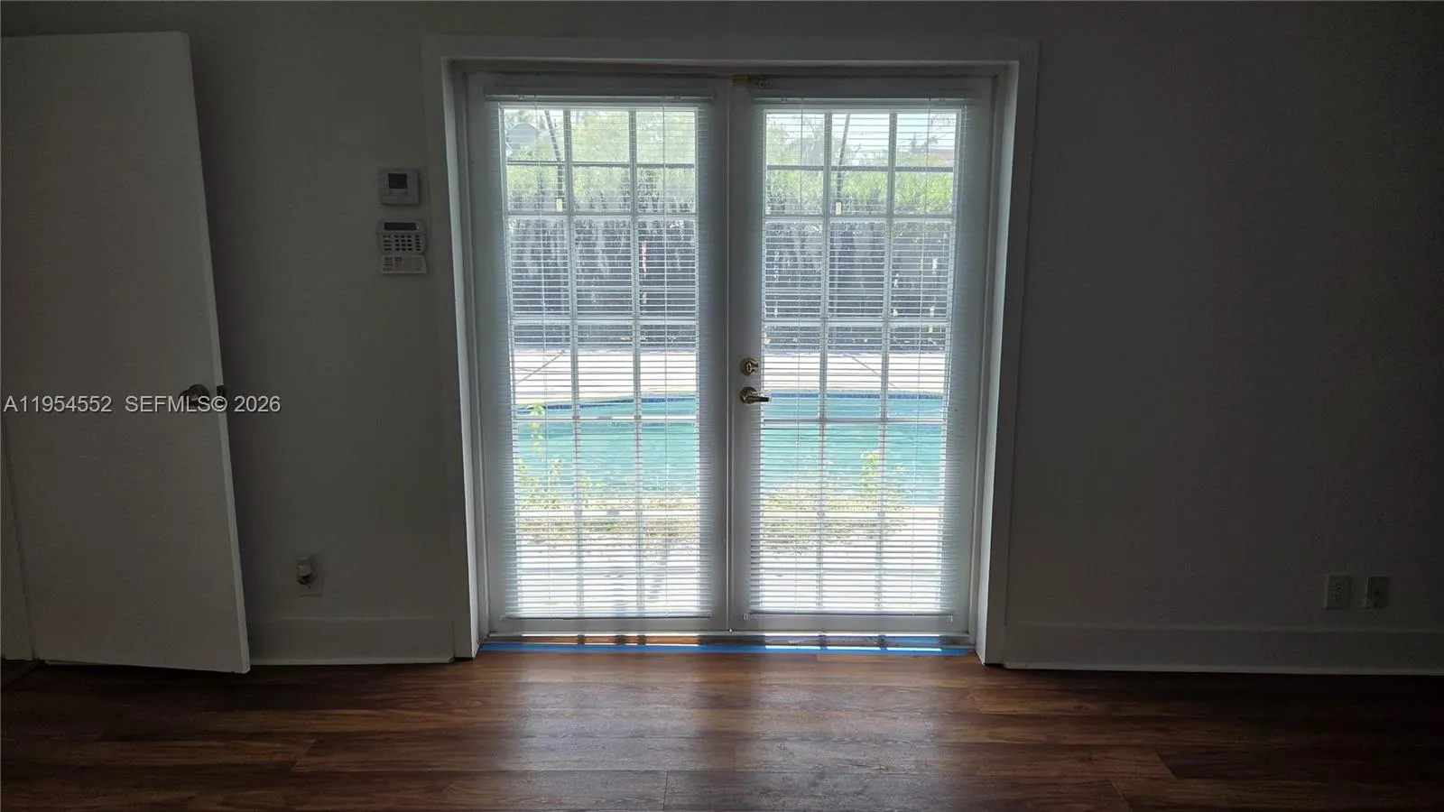 Master Bedroom 15' x 25" with access to screened pool and patio.