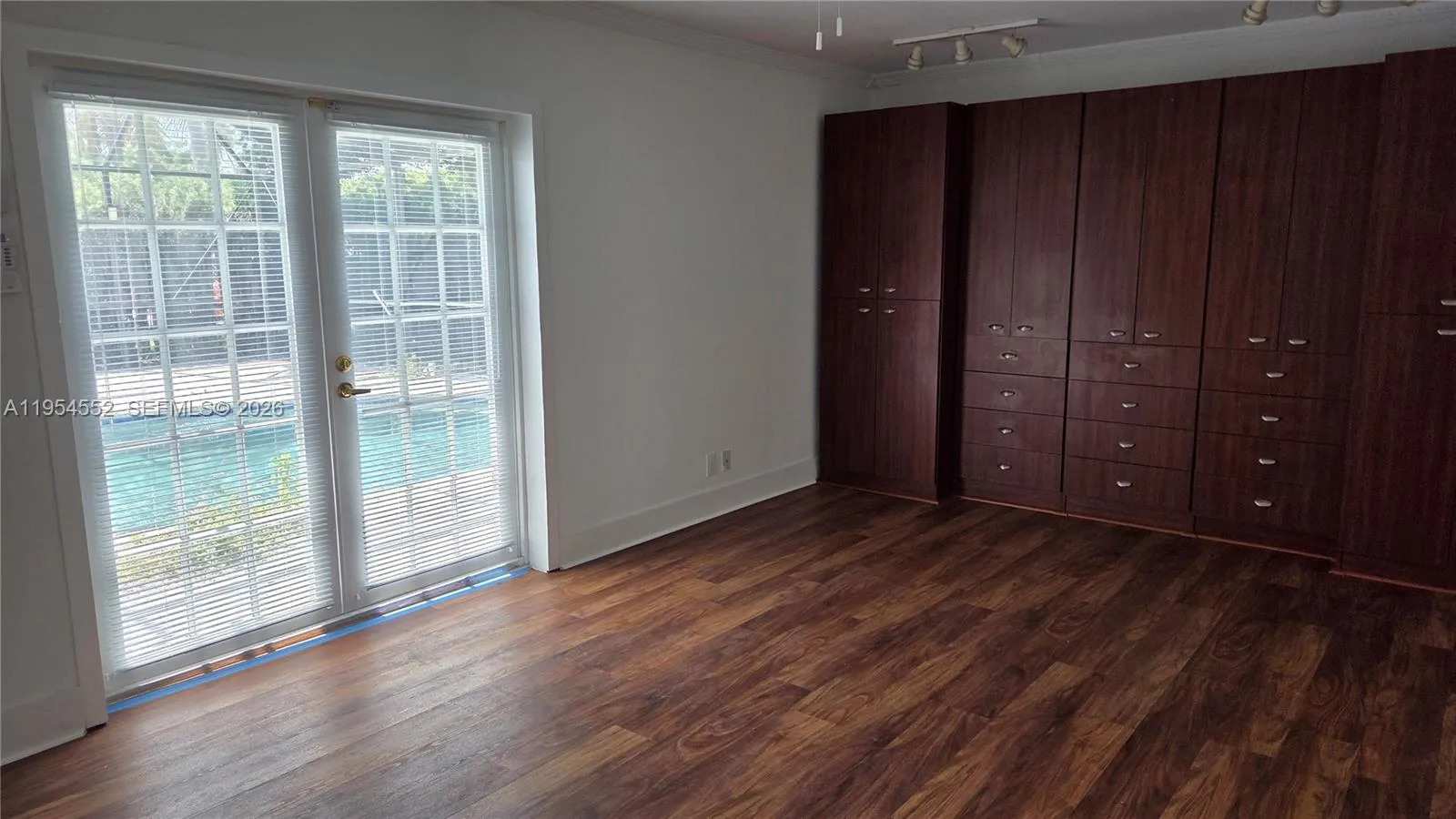 Master Bedroom 15' x 25" with access to screened pool and patio.