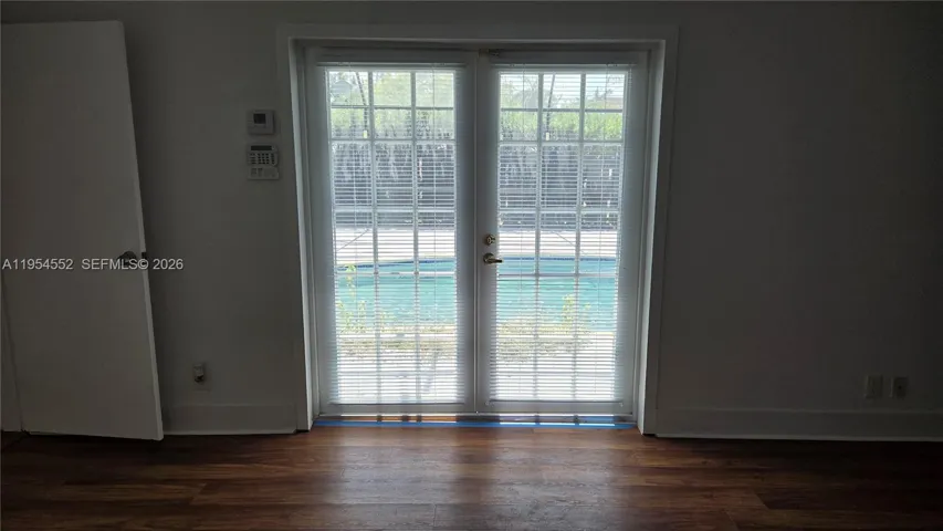 Master Bedroom 15' x 25" with access to screened pool and patio.