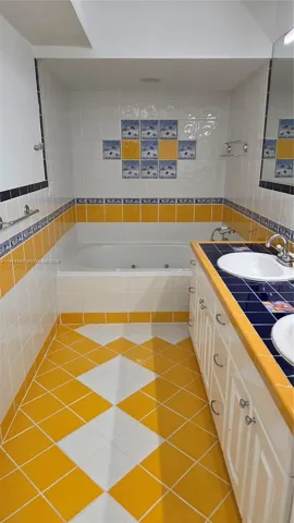 Master Bath with Dual Sinks and Jacuzzi Tub