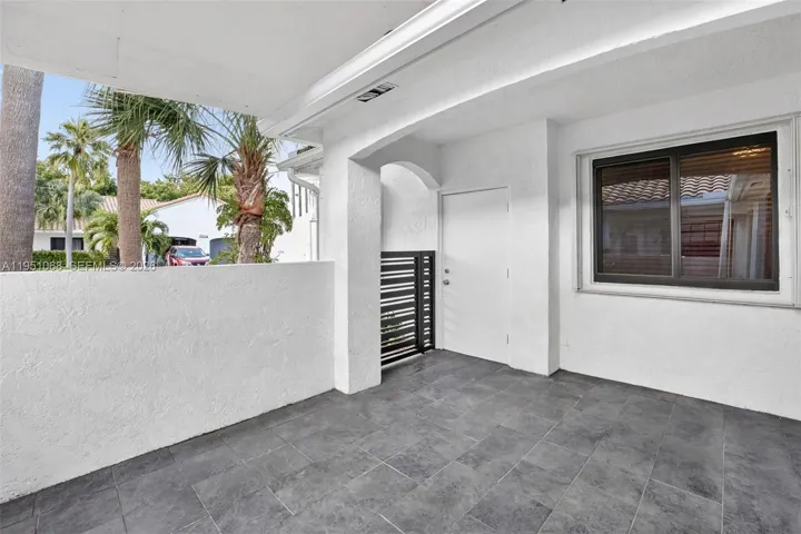 Virtually Staged Front Entry Patio(Furniture removed)