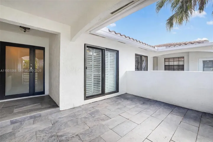 Virtually Staged Front Entry Patio(Furniture removed)