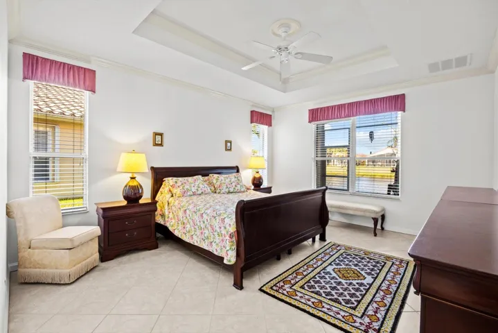 Master bedroom with Tray ceilings/crown molding with lake view...