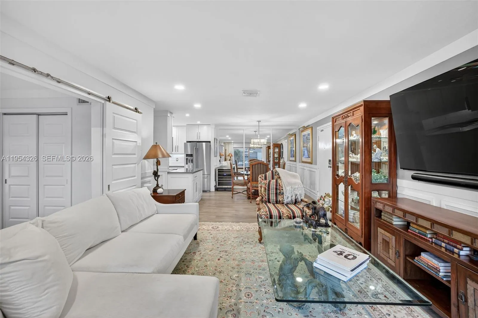 Large great room that opens to 3rd bedroom w/ barn doors. Perfect room to make into a home office (w/ murphy bed and desk)
