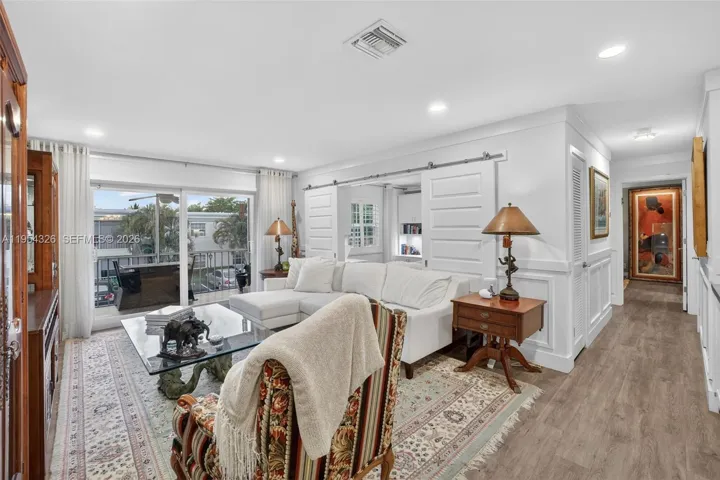Beautifully updated w/ Smart Lighting & Plank Flooring & Impact windows and doors