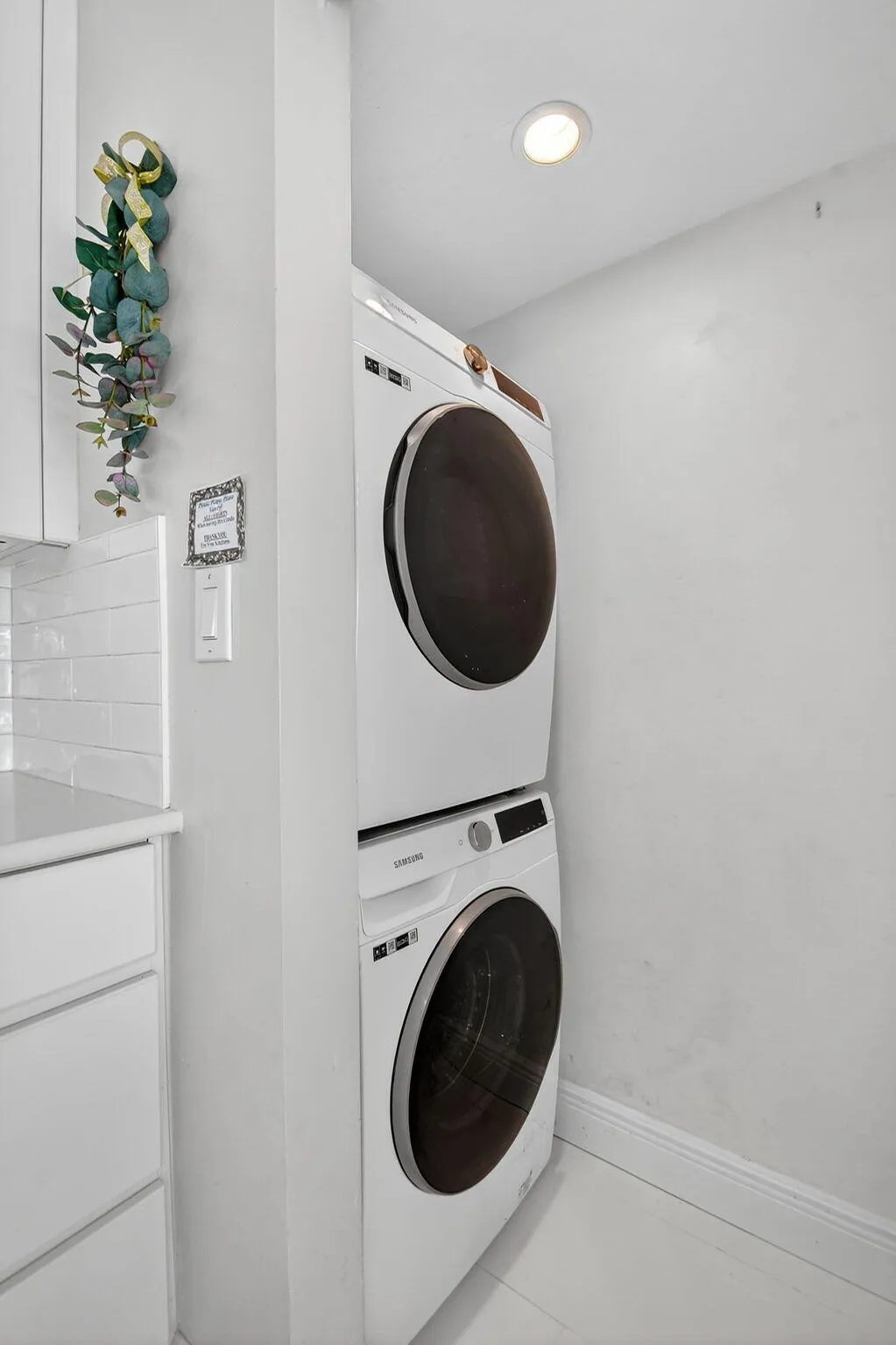 Hidden washer and dryer behind the sliding glass