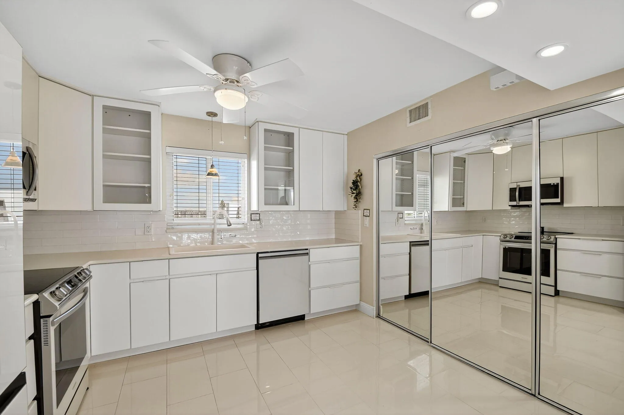 Featuring Mirrored Storage doors...Hiding the Tankless Water Heater and Washer/Dryer
