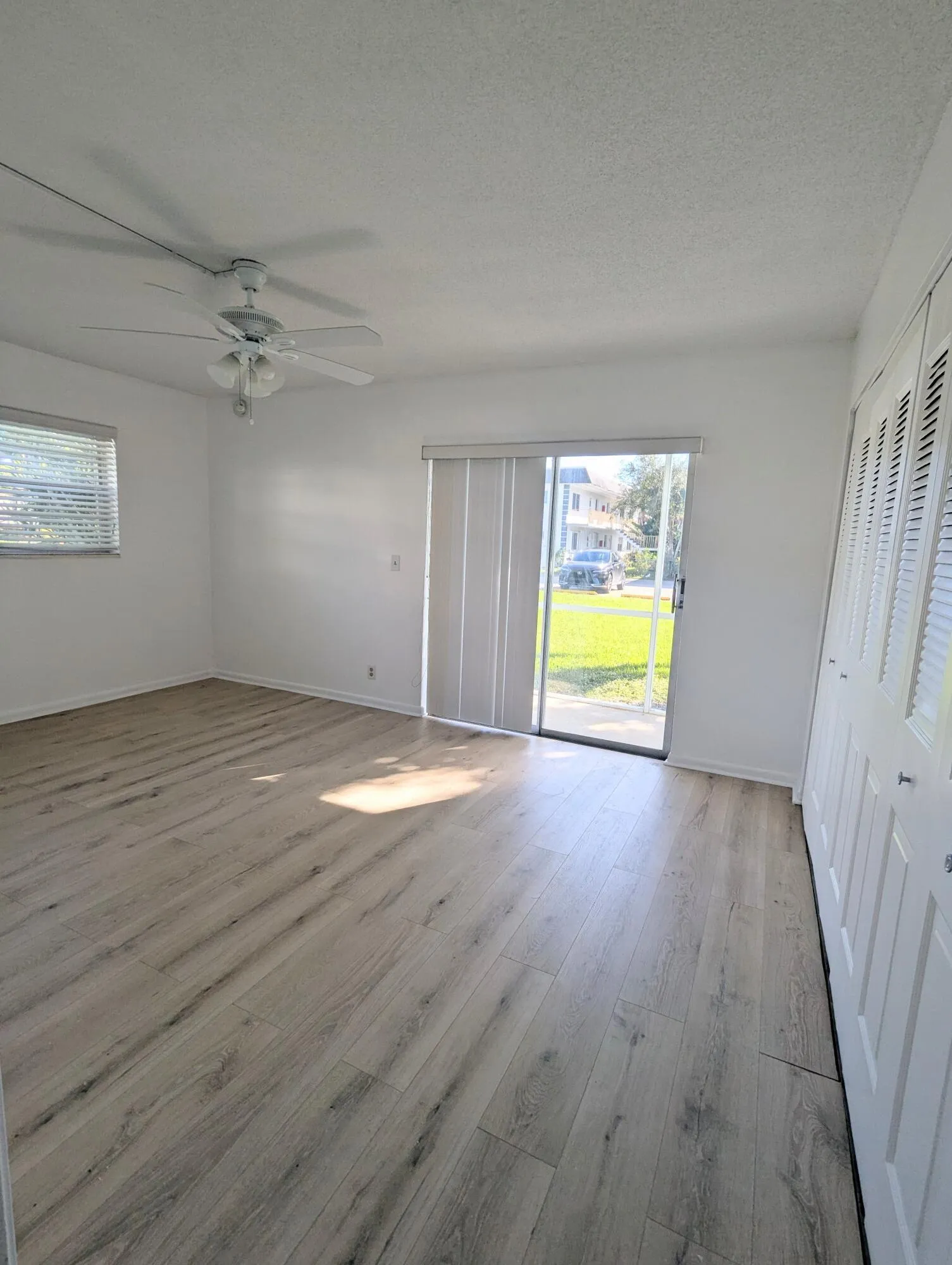 Spacious Bedroom with Wall of Closts