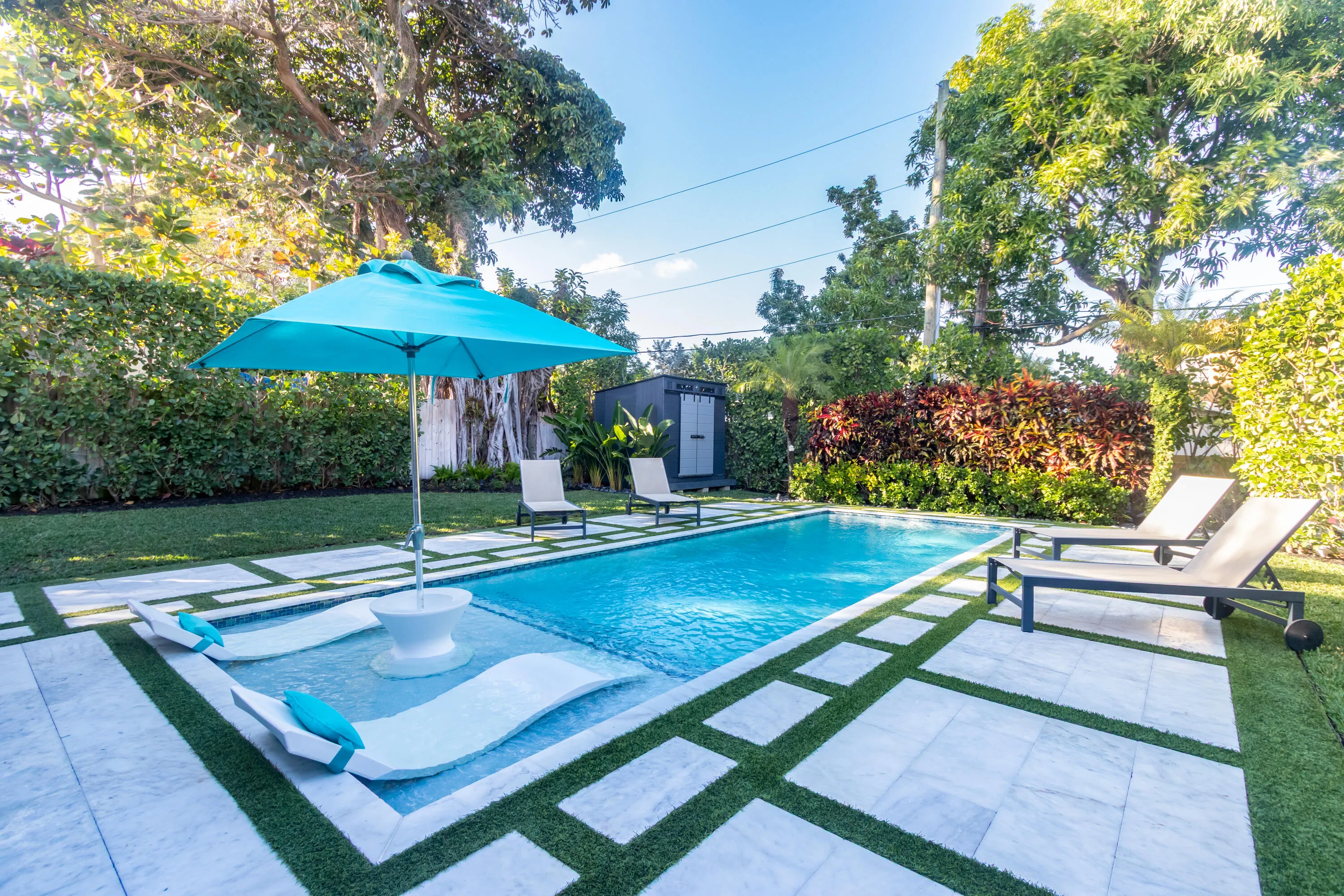 Salt-water pool with sun shelf, heater, & a chiller.