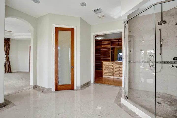Owner's Primary Ensuite 1 with Dual Water Closets w/Bidet, Whirlpool Tub, Shower, & Dual Vanities Second Floor