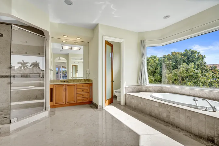 Owner's Primary Ensuite 1 with Dual Water Closets w/Bidet, Whirlpool Tub, Shower, & Dual Vanities Second Floor