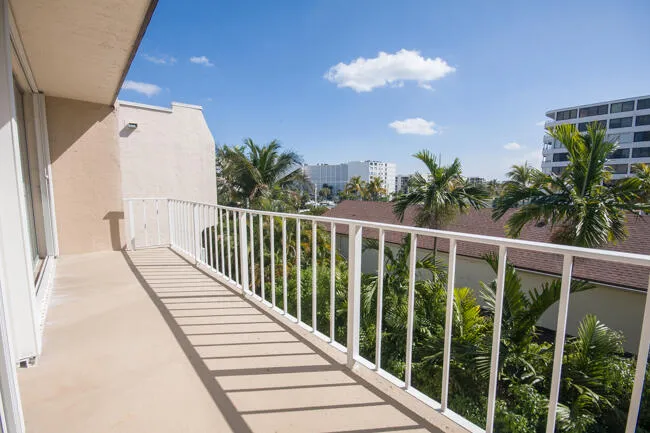 Large balcony stretches 22' x 6', from Living room to primary bedroom sliding doors.