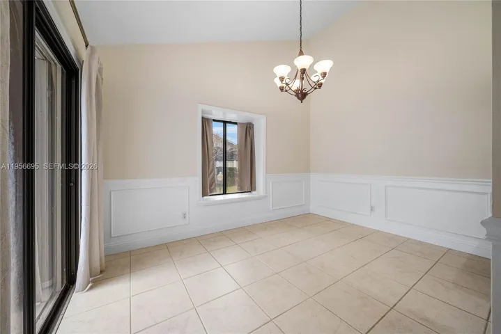 Formal dining room opens to courtyard/pool