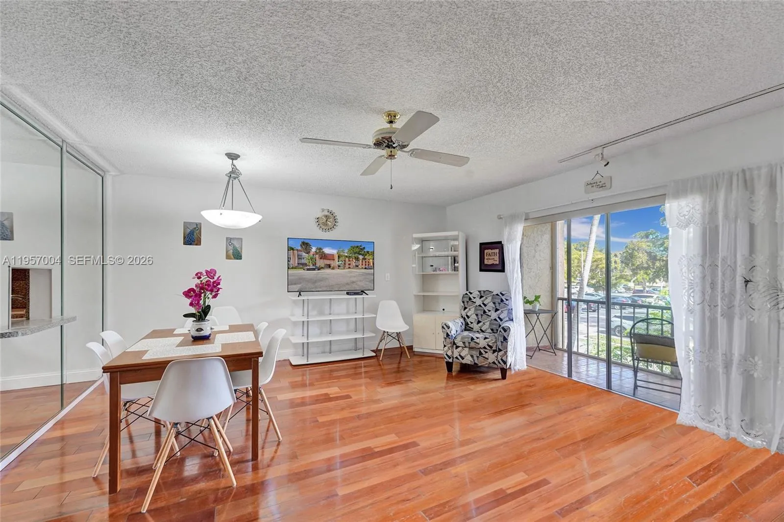 The living room is spacious and inviting, with ample natural light and a comfortable layout for relaxation and entertaining.